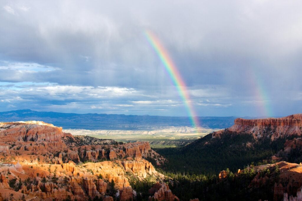 Rainbow over Colorado mountains symbolizes that it is possible to recover from alcohol or drug abuse with therapy and hardwork