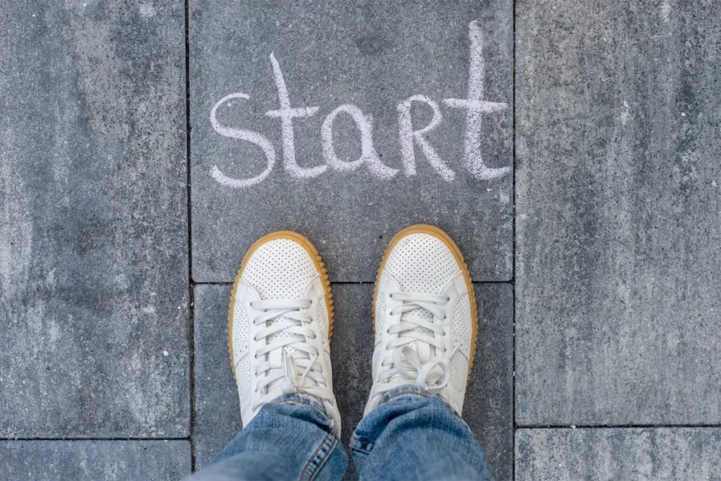 Three simple steps to get started with therapy, illustrated with feet at a chalk 'start' line.