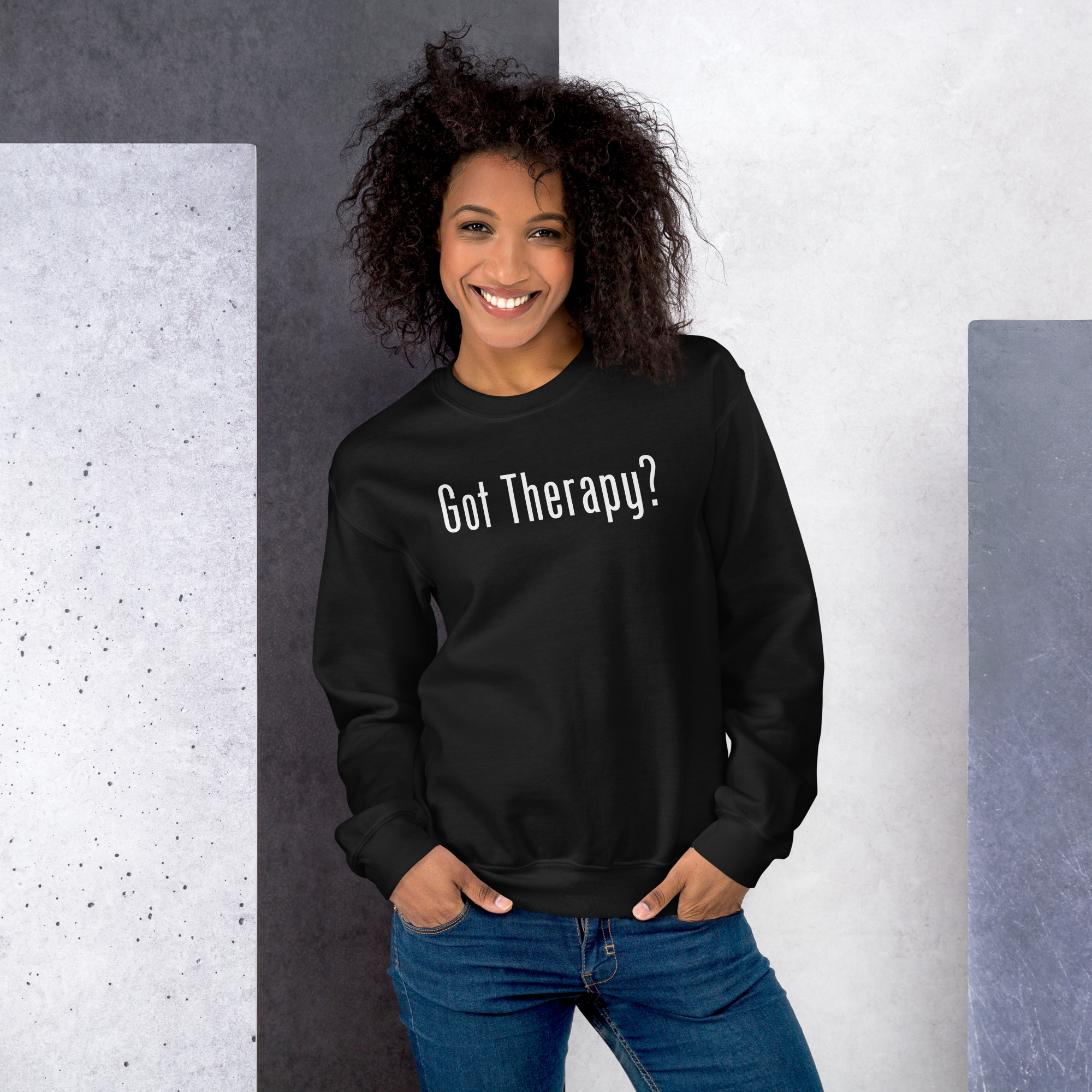 Smiling woman modeling a black sweatshirt featuring the text 'Got Therapy?'.