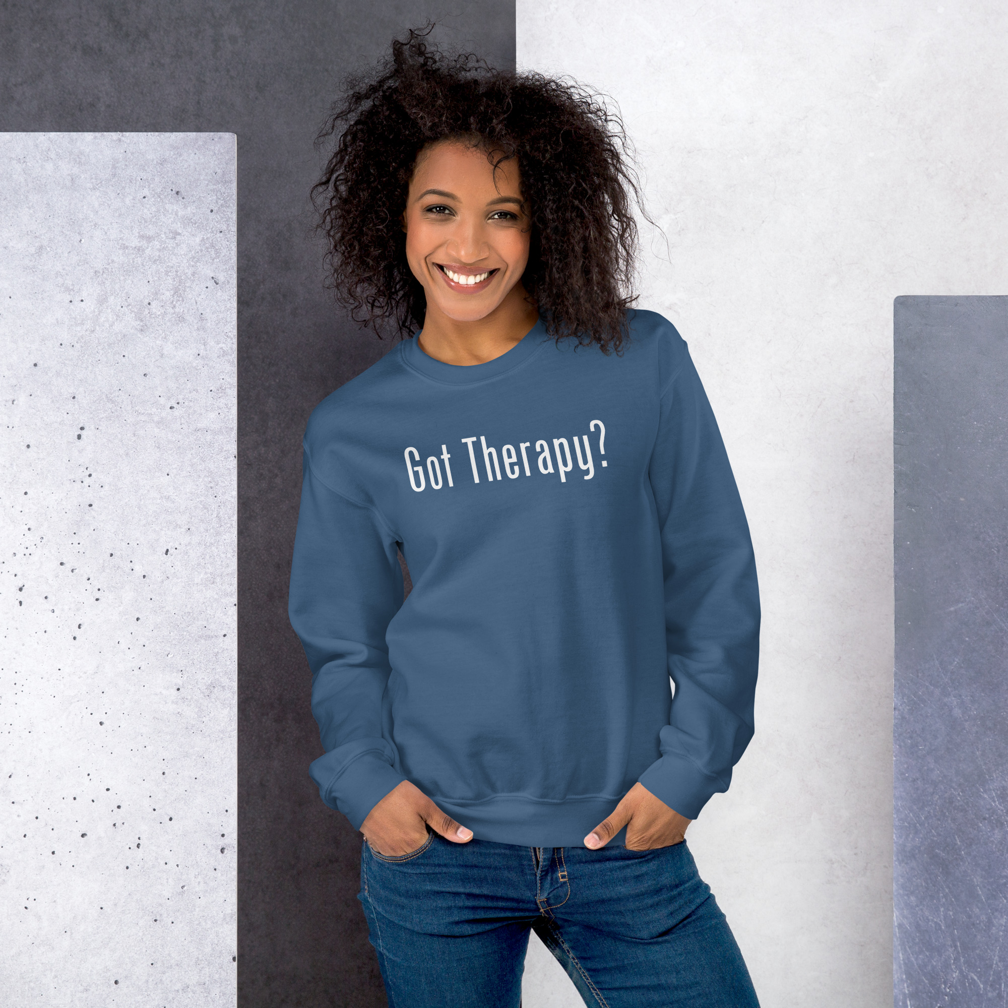 Smiling woman modeling a steel blue sweatshirt featuring the text 'Got Therapy?'.