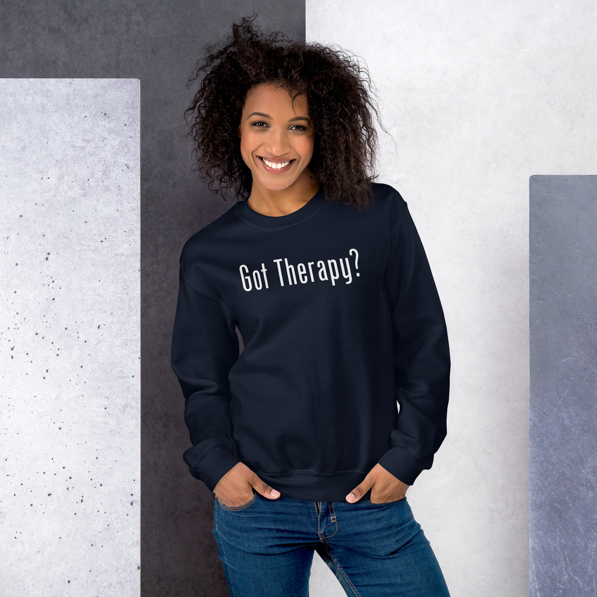 Smiling woman modeling a navy blue sweatshirt featuring the text 'Got Therapy?'.