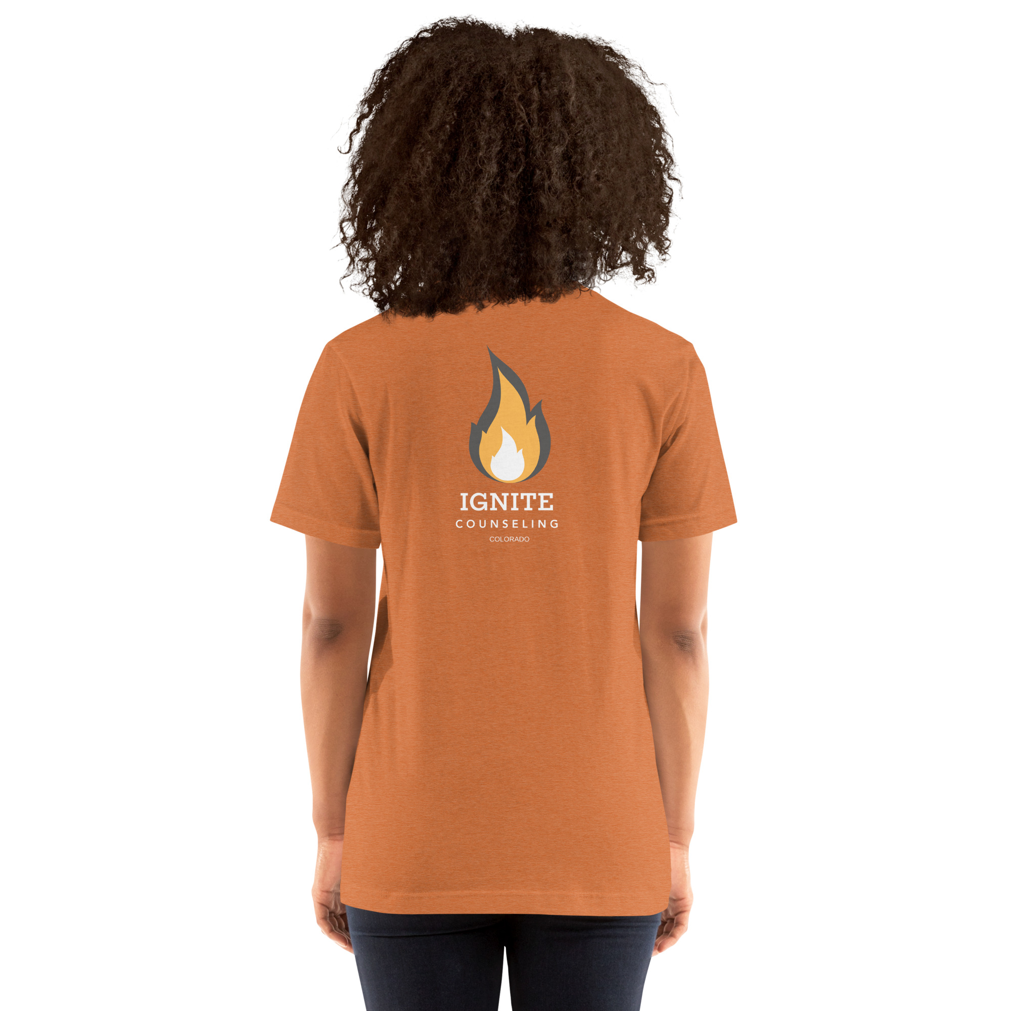 Back view of a heather orange t-shirt featuring the Ignite Counseling Colorado flame logo.
