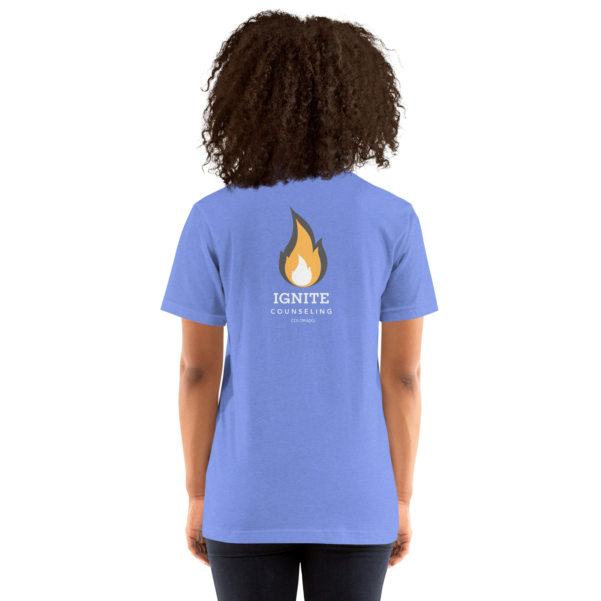 Back view of a periwinkle blue t-shirt featuring the Ignite Counseling Colorado flame logo.