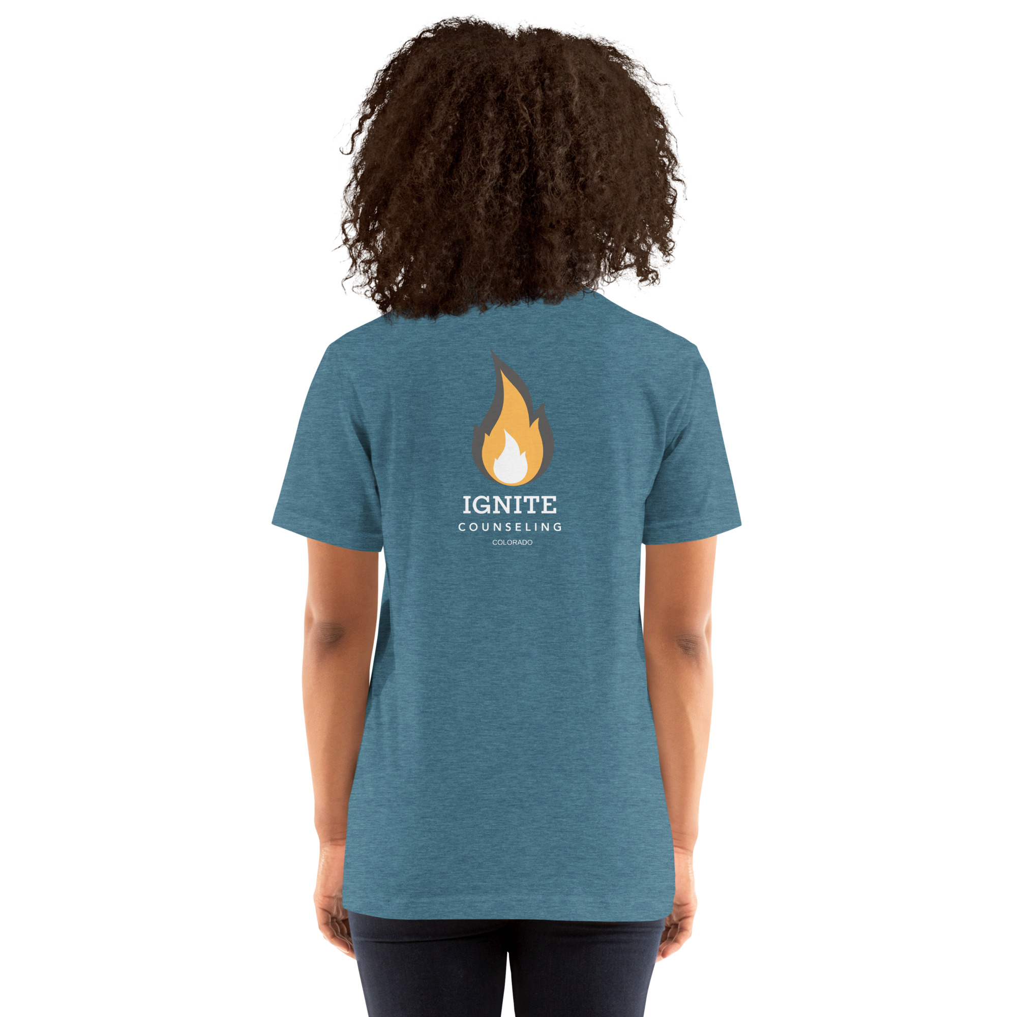 Back view of a heather deep teal t-shirt featuring the Ignite Counseling Colorado flame logo.