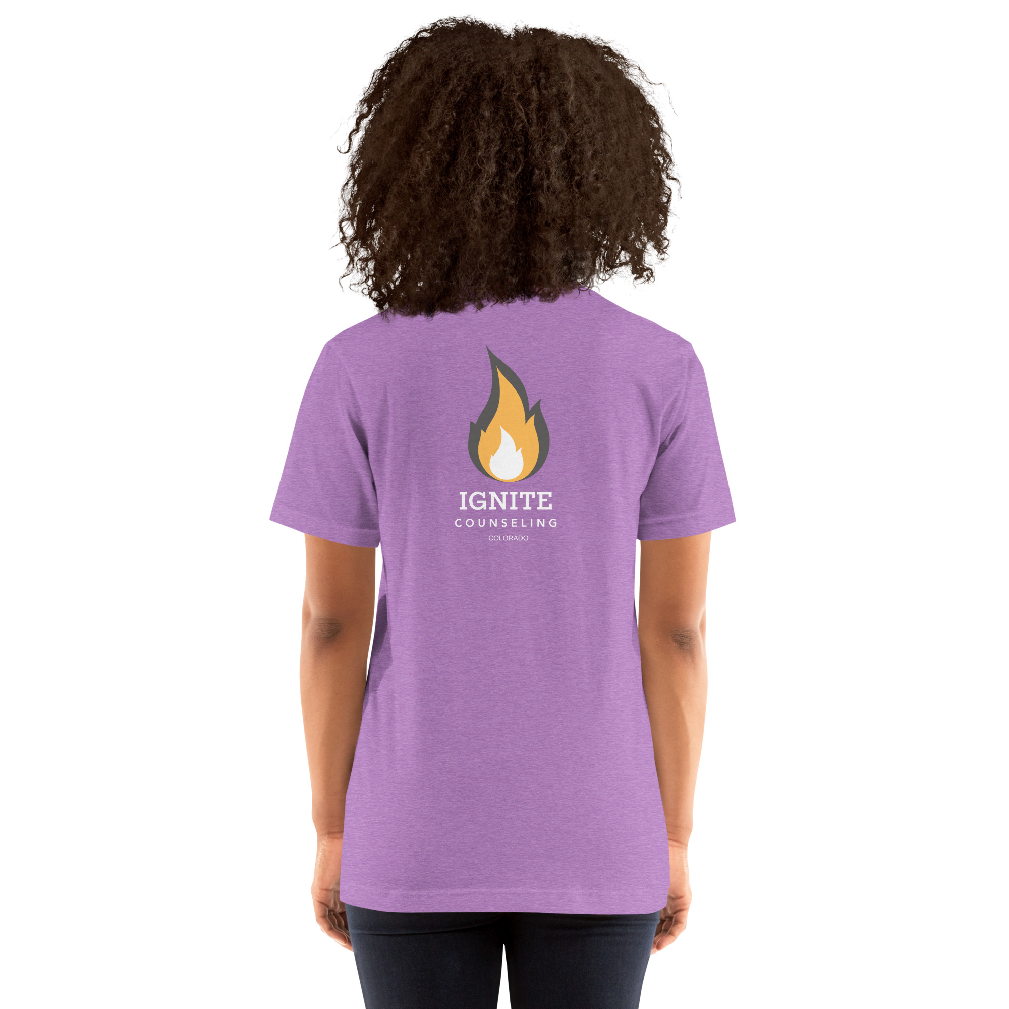 Back view of a heather orchid t-shirt featuring the Ignite Counseling Colorado flame logo.