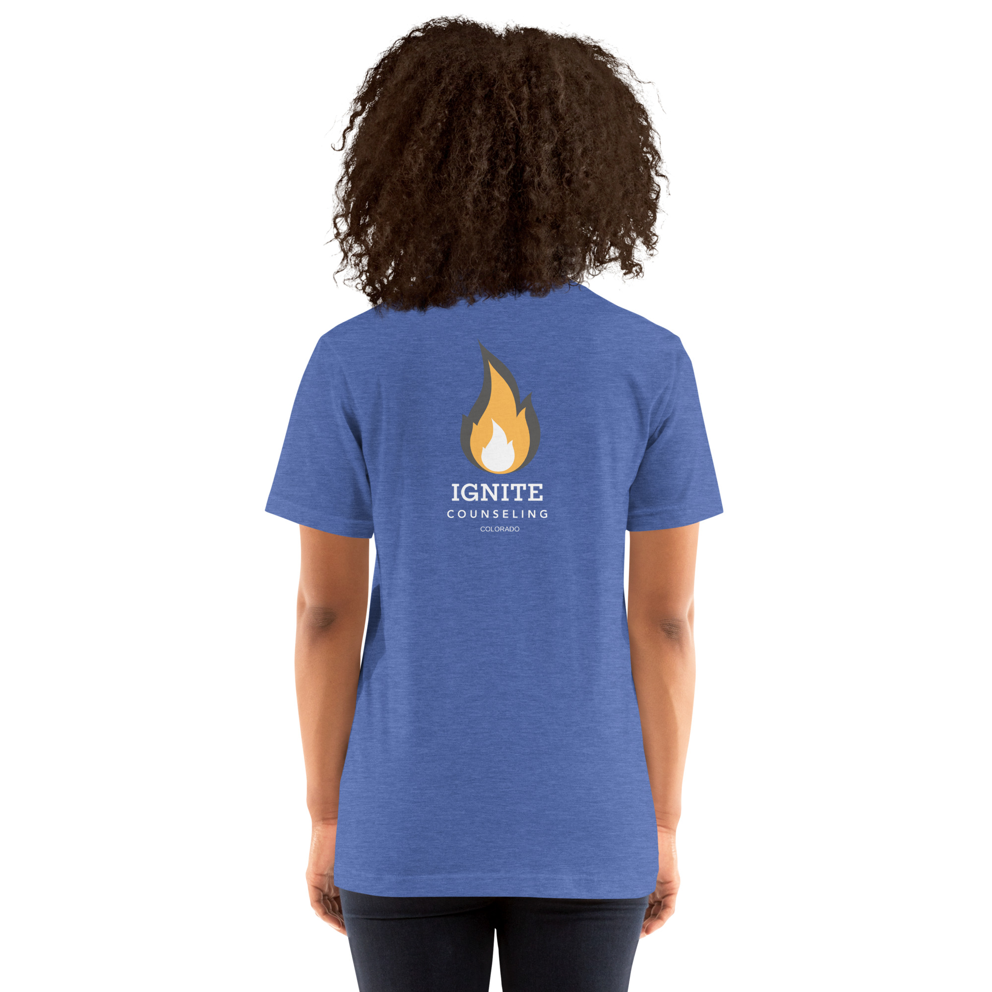 Back view of a heather royal blue t-shirt featuring the Ignite Counseling Colorado flame logo.