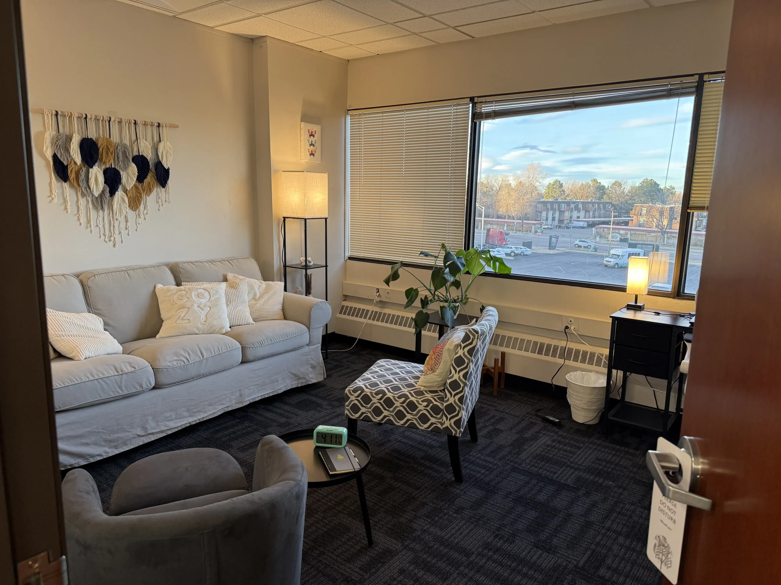 Cozy therapy office at Ignite Counseling Colorado featuring comfortable seating, natural light, and a private atmosphere.