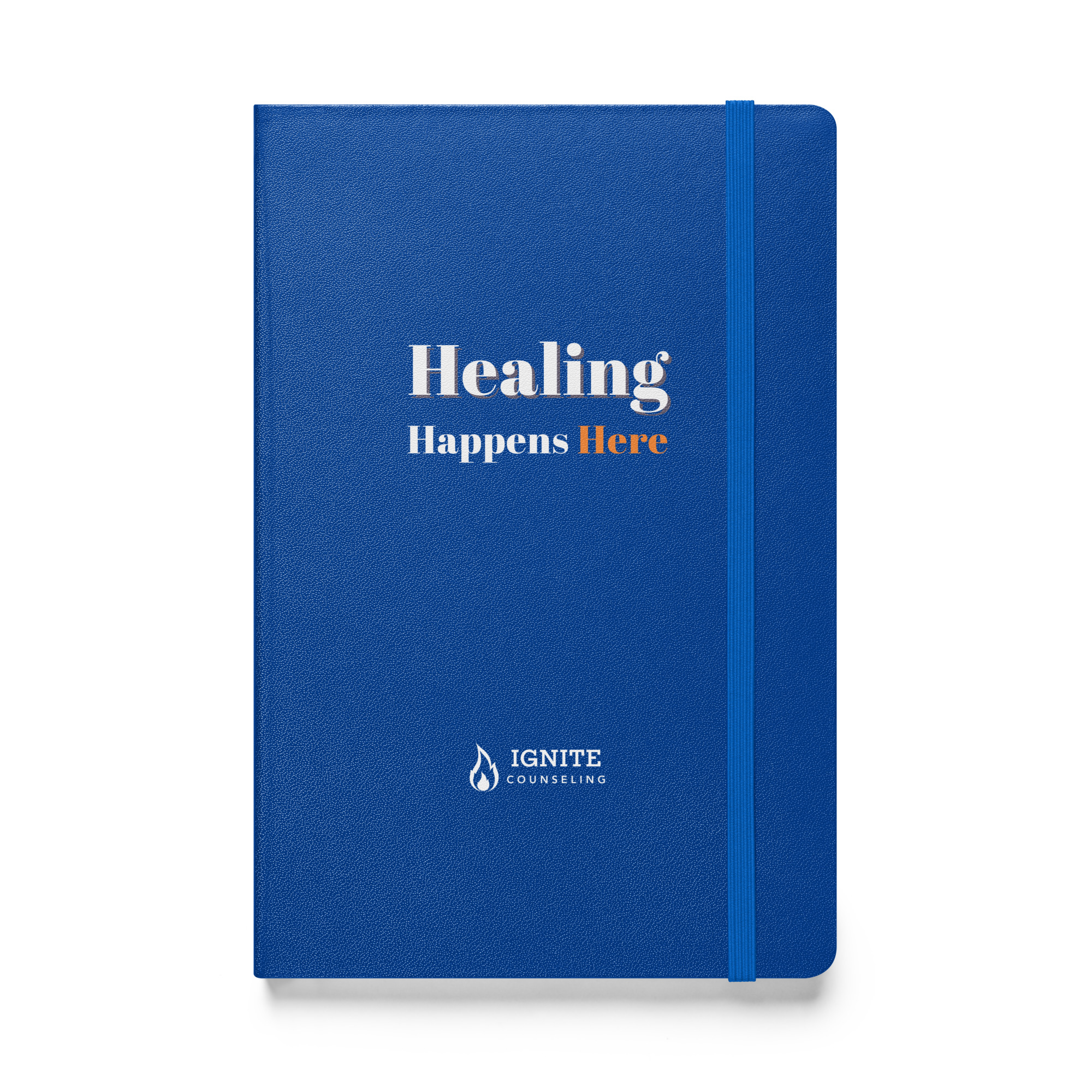 Blue hardcover journal featuring the text 'Healing Happens Here' and the Ignite Counseling logo.