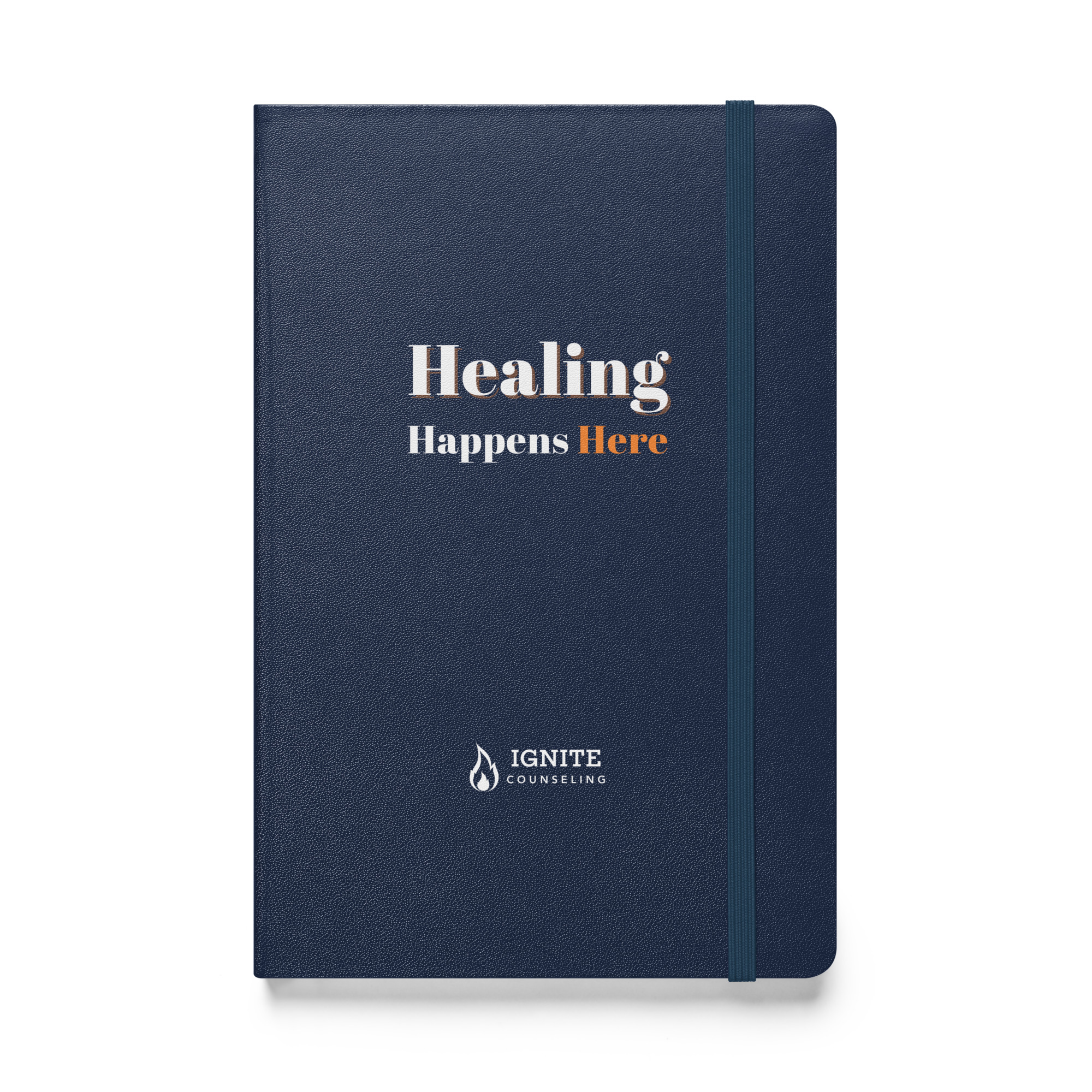 Navy blue hardcover journal featuring the Ignite Counseling logo and the phrase 'Healing Happens Here'.