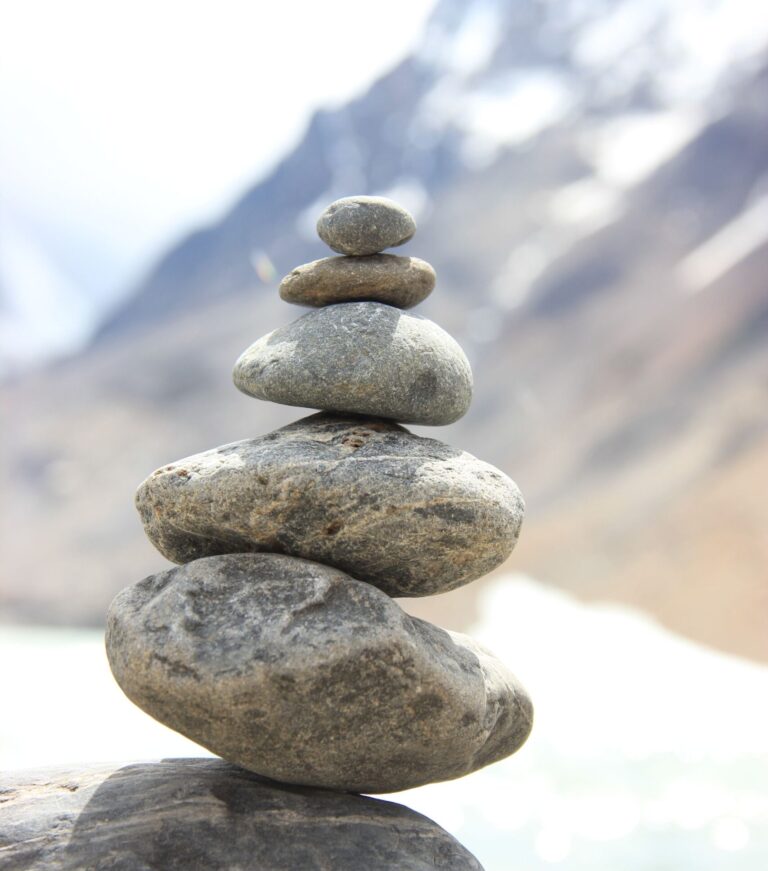 Stacked stones in Colorado represent mindfulness skills learned in DBT-informed therapy at Ignite Counseling Colorado