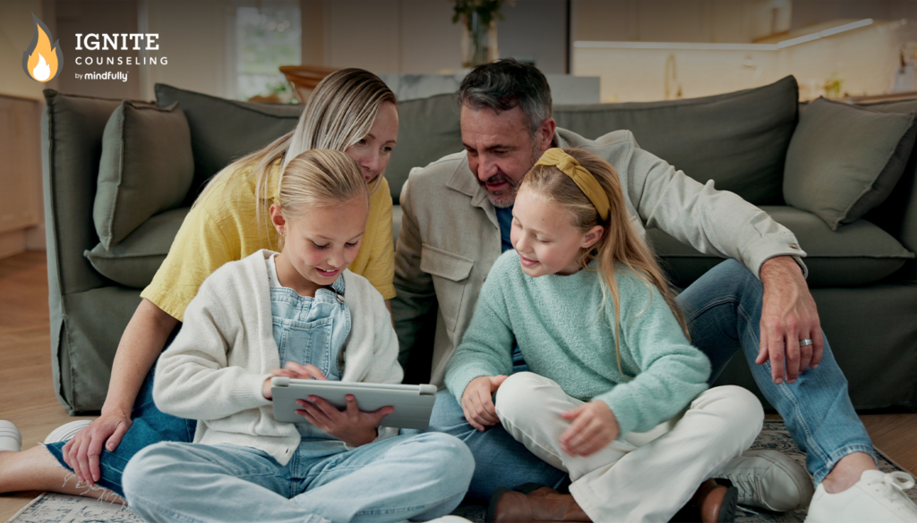 A family of four sits together on a sofa, serving as the featured image for the blog titled "Does Your Child Need Extra Support After School Day?